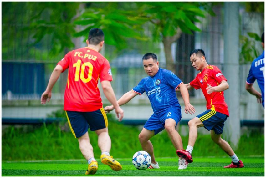 Amateur soccer players in action during a local ma