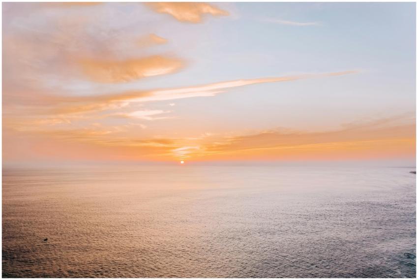 A beautiful aerial sunset over the ocean, showcasi