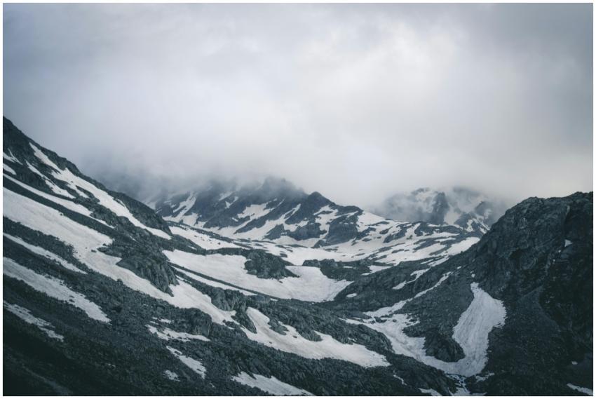Breathtaking snowy mountain landscape with misty p