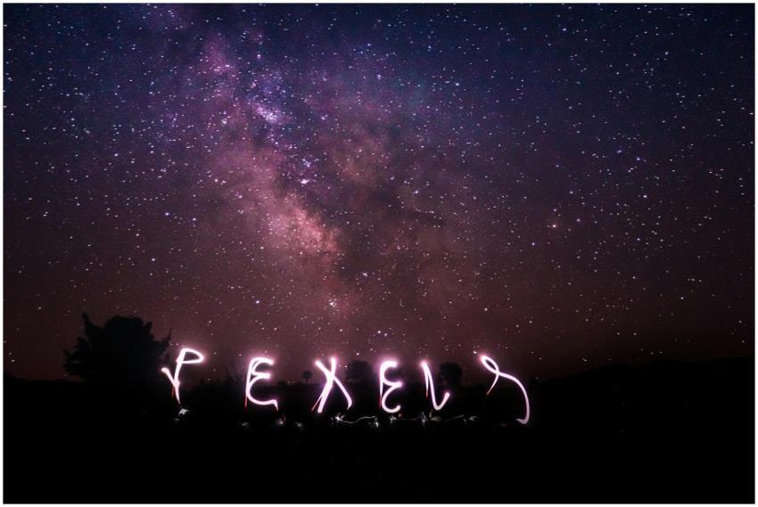 Long exposure shot capturing a starry night sky wi