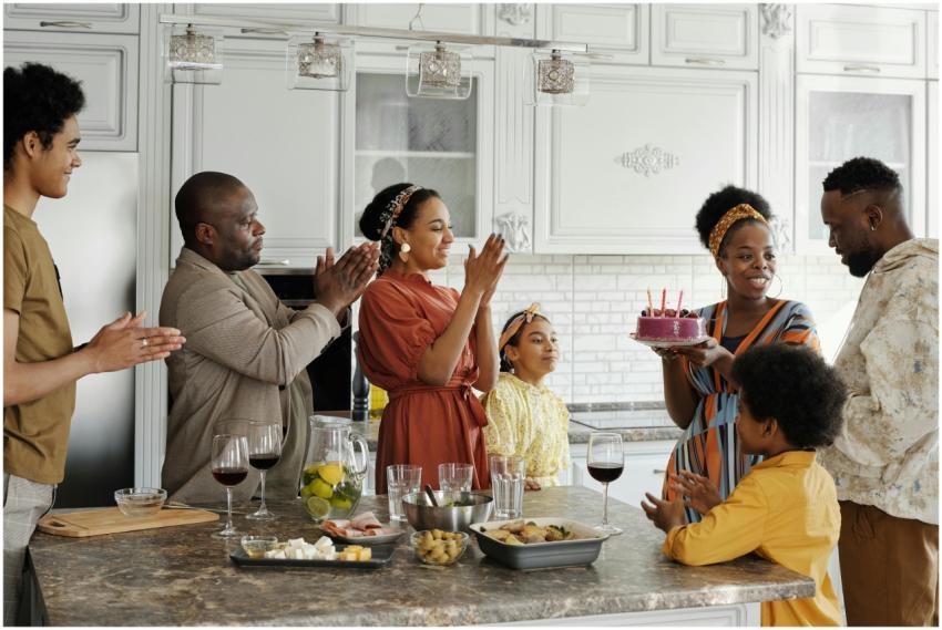 Joyous family birthday celebration with cake and c