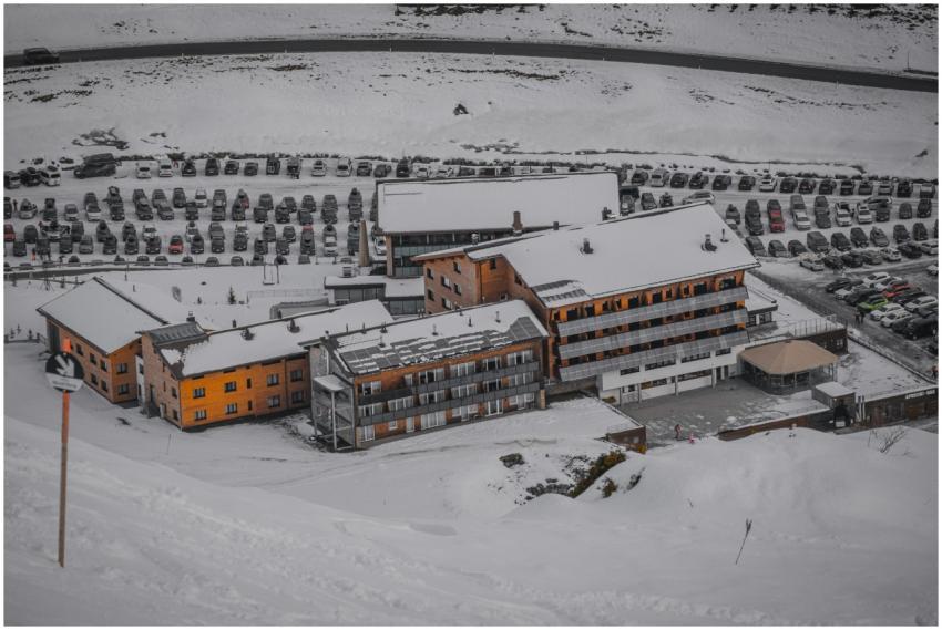 Aerial view of a snow-covered ski resort with a fu