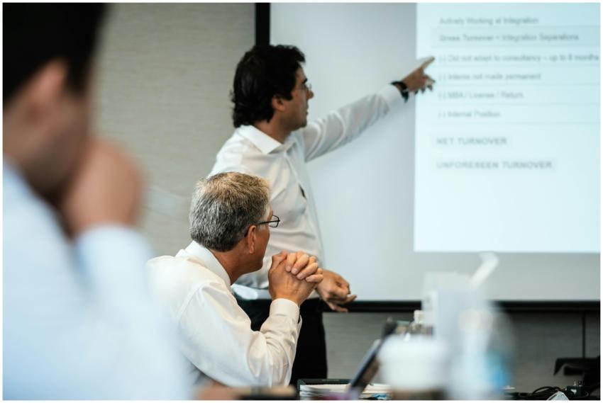 Professional setting with team members focused on