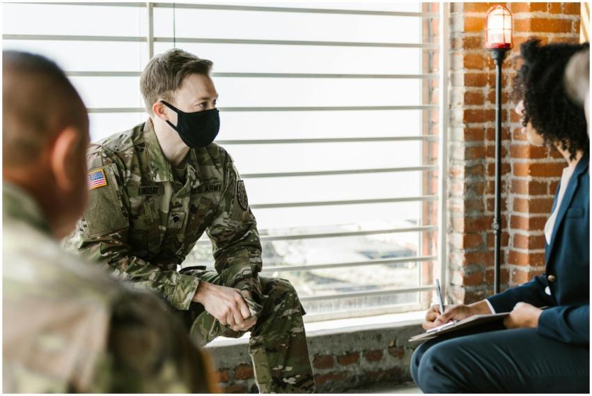 US Army personnel in a group therapy session with