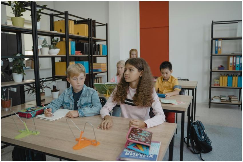 Students engaging in classroom learning at desks w