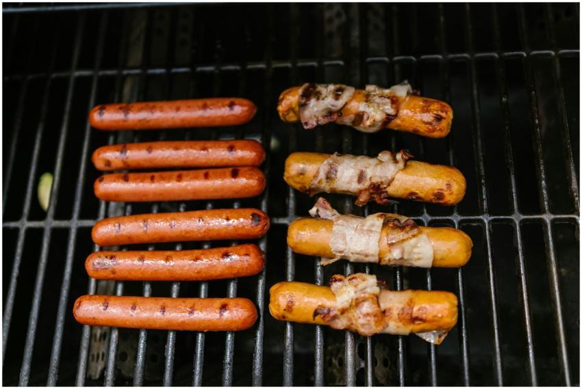 Grilled hot dogs and sausages wrapped in bacon coo