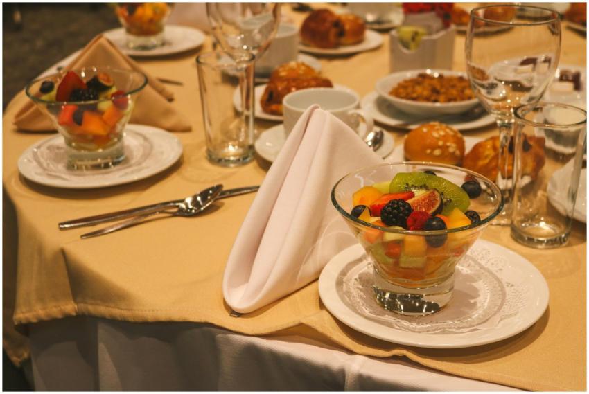 Elegant table setting featuring glasses of fresh f
