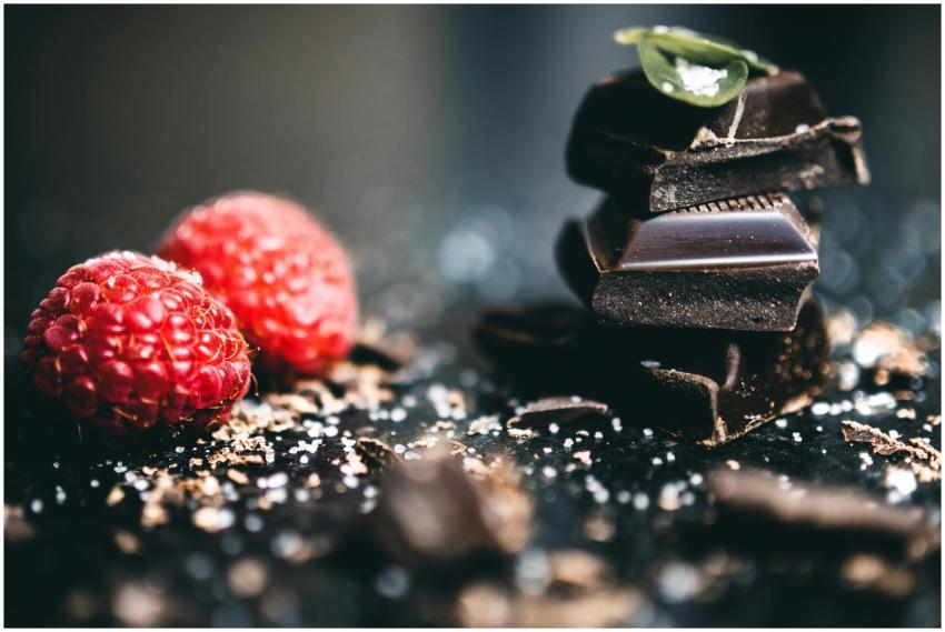 Artistic close-up of dark chocolate pieces with fr