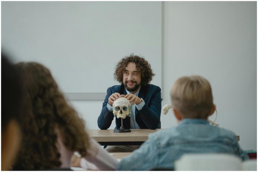 Teacher engaging students with a skull model in an