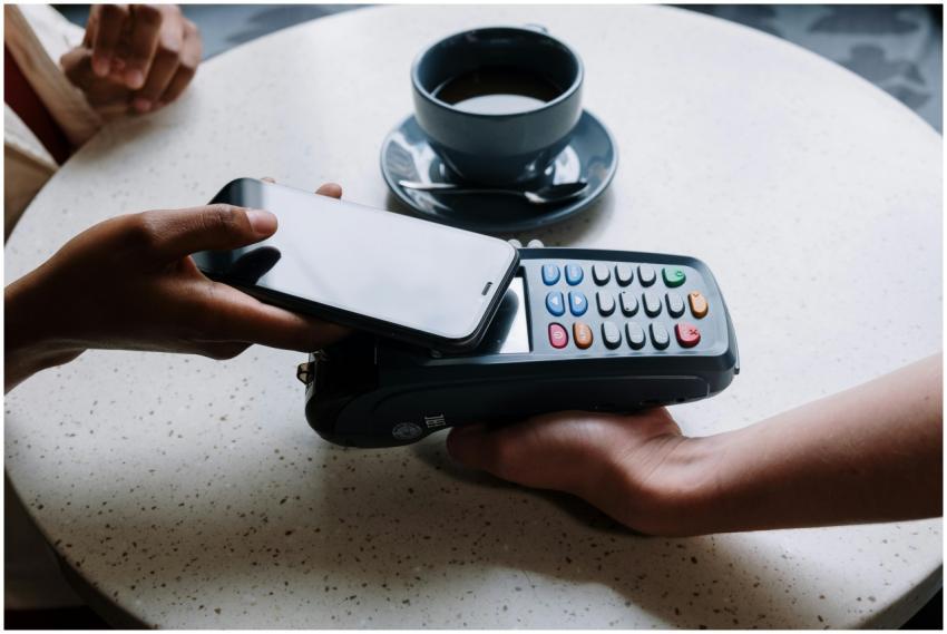 A person using a smartphone to make a contactless