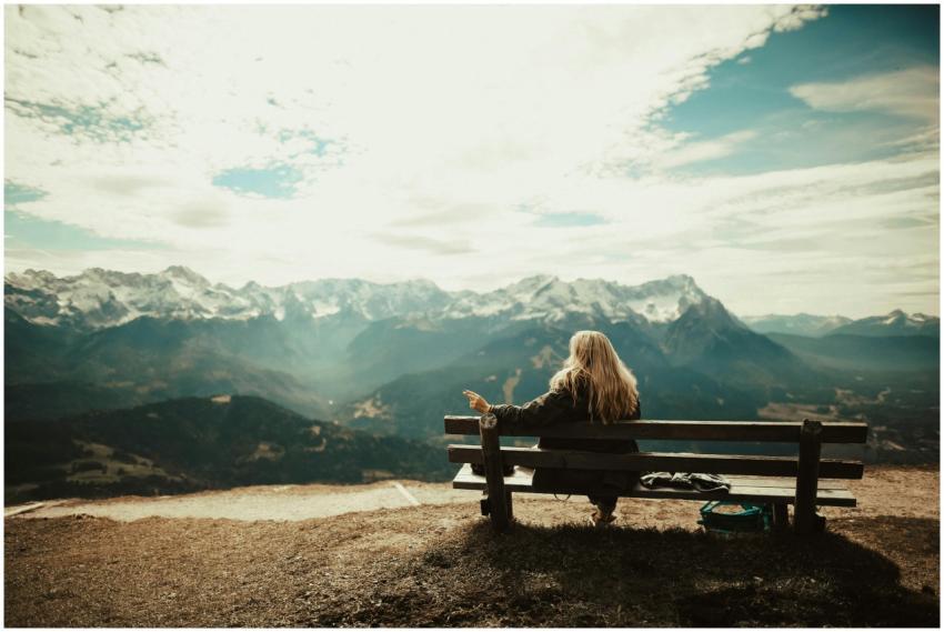 Woman enjoys a peaceful view of snow-capped mounta