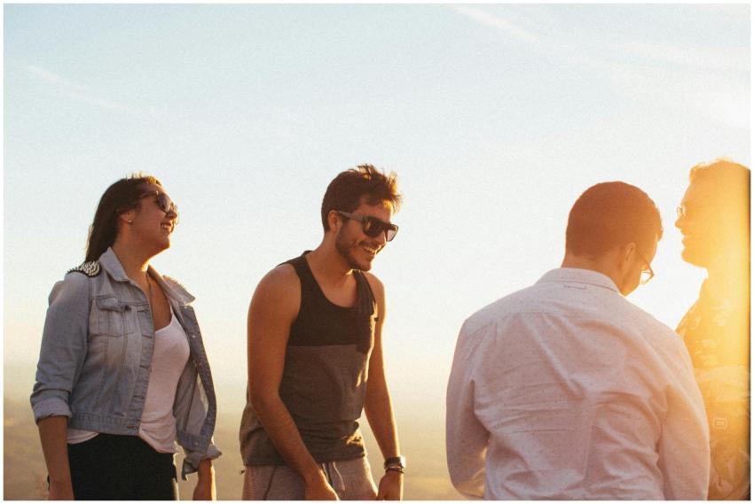 A group of friends laughing and enjoying the golde