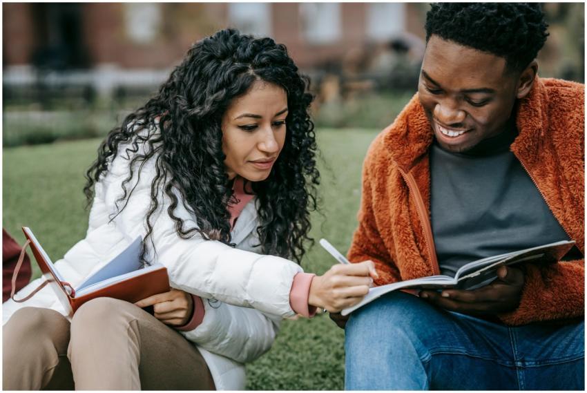 Two students collaborating and studying together o