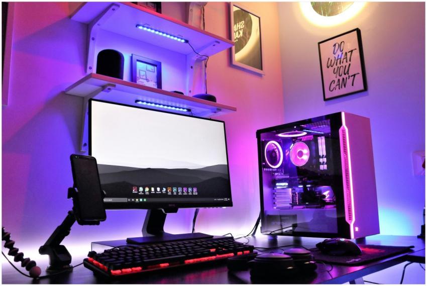 A sleek gaming setup featuring RGB lighting with a