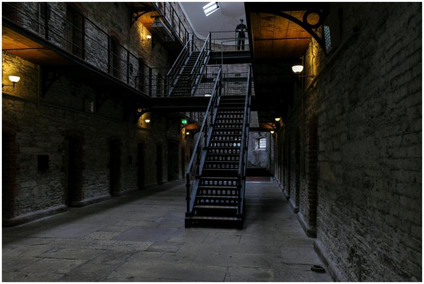 Explore a dimly lit corridor with a historic stair