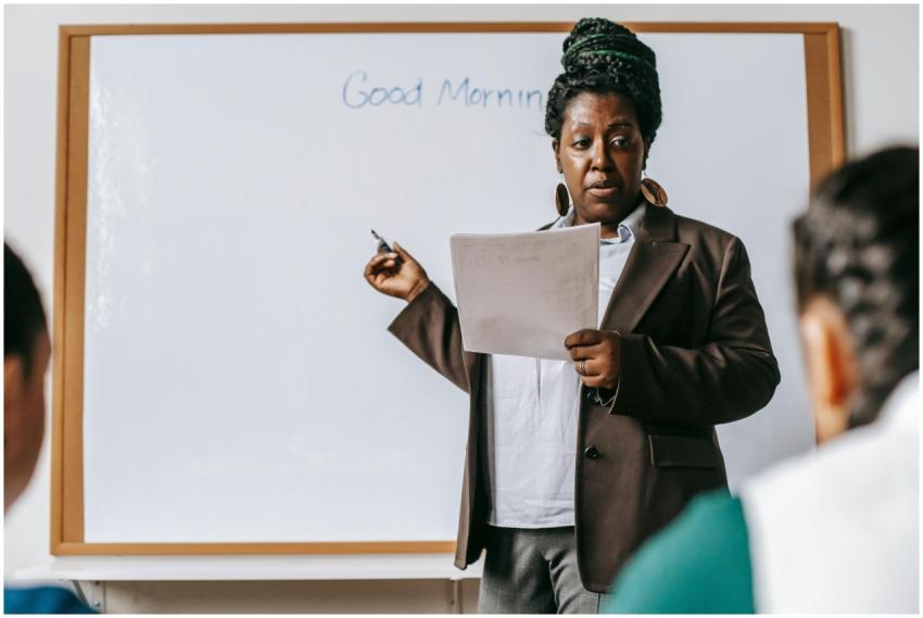 Concentrated adult African American female teacher