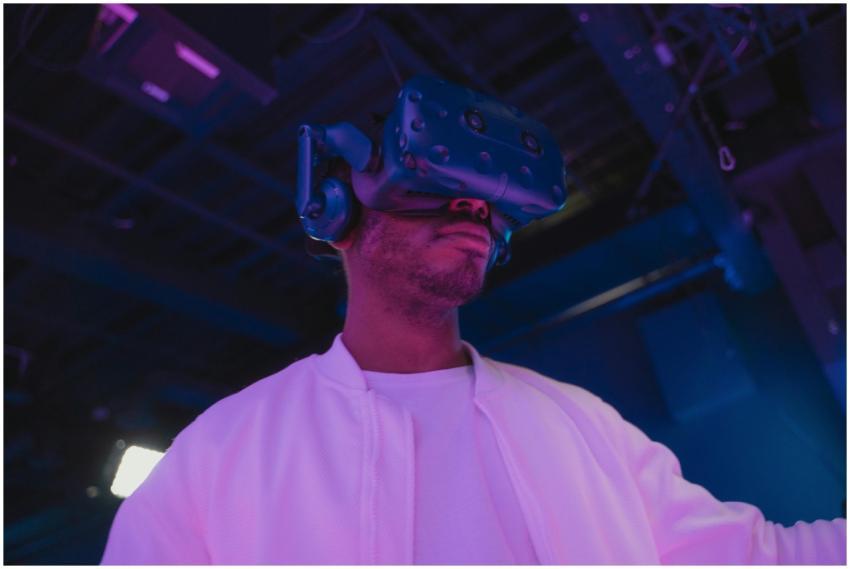 A man wearing a VR headset engaged in a virtual re