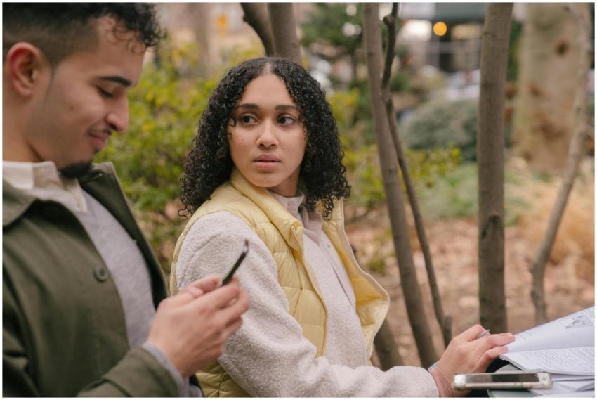 Side view of Hispanic female sitting at table with