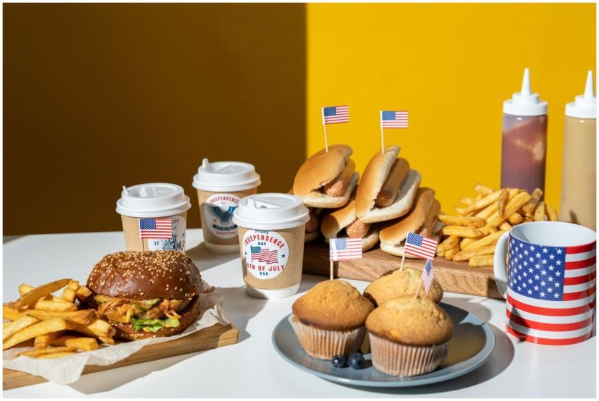 Festive 4th of July food setup with burgers, fries