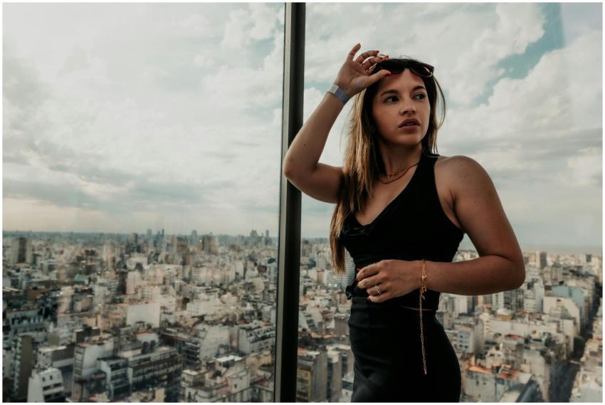 Stylish woman in black dress posing with a stunnin
