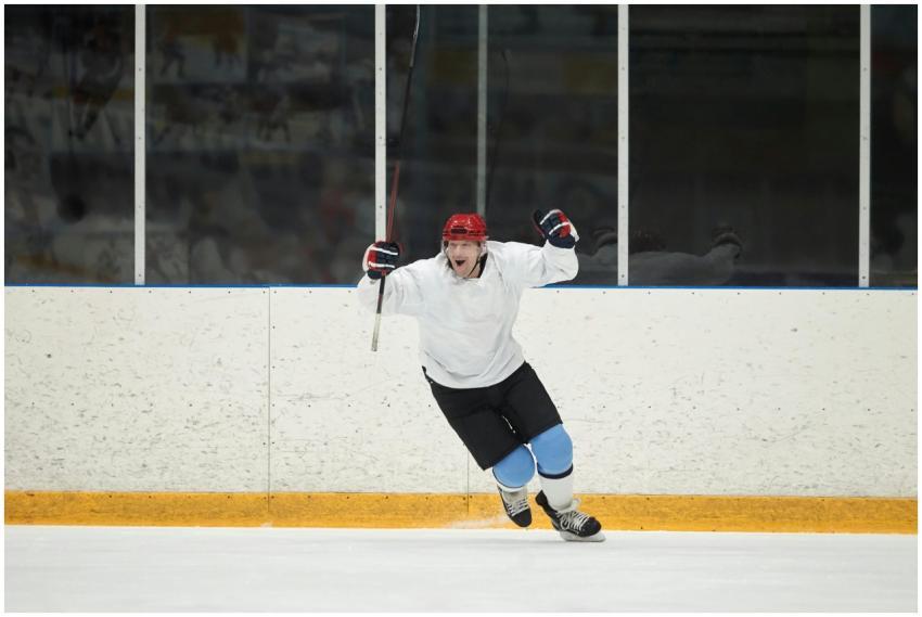 Dynamic action shot of a hockey player celebrating