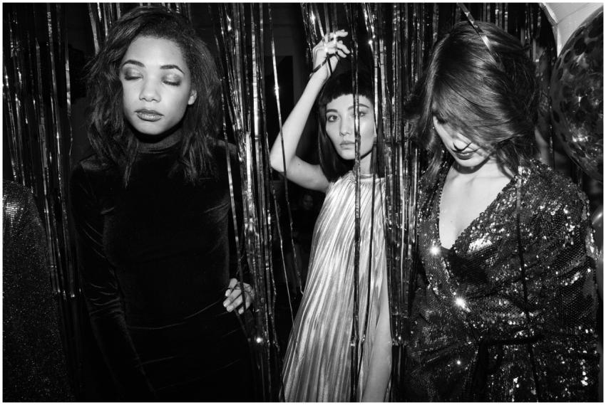 Chic monochrome photo of young women celebrating a