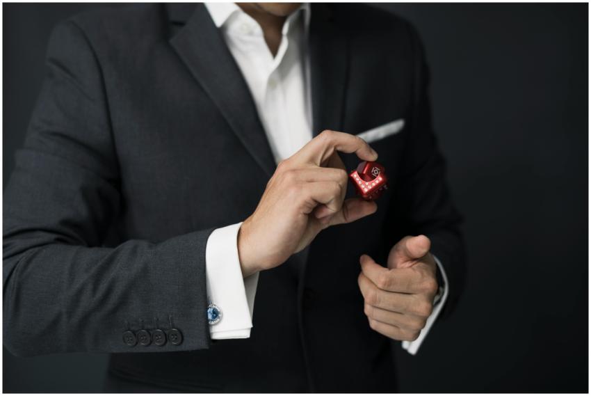 A businessman elegantly dressed in a suit holding