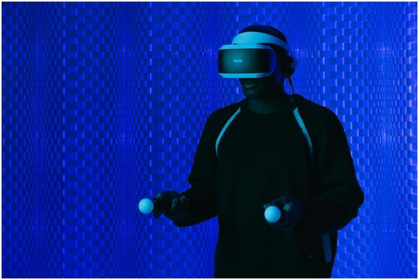 A man wearing a VR headset and using controllers i