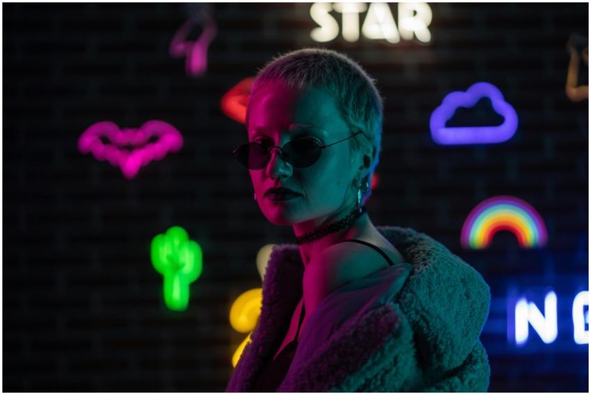 Fashionable woman with sunglasses and fur jacket i