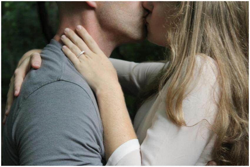 Close-up of a couple kissing outdoors, highlightin