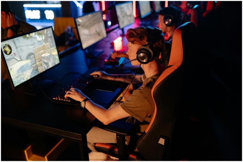 A group of gamers focused on a competitive match i