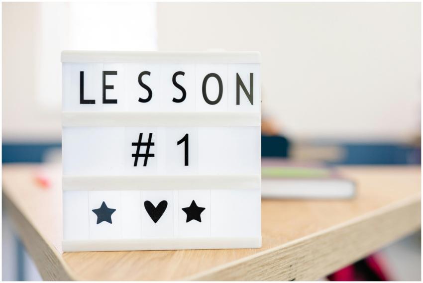Lightbox sign displaying 'Lesson #1' in a classroo