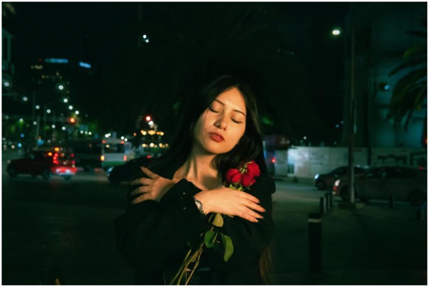 A serene moment with a young woman holding roses a