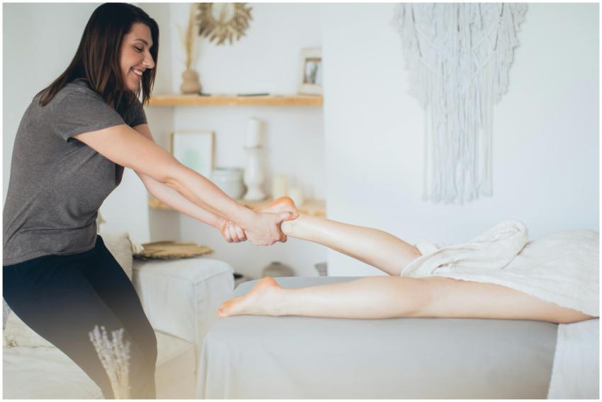 A massage therapist giving a foot massage in a coz