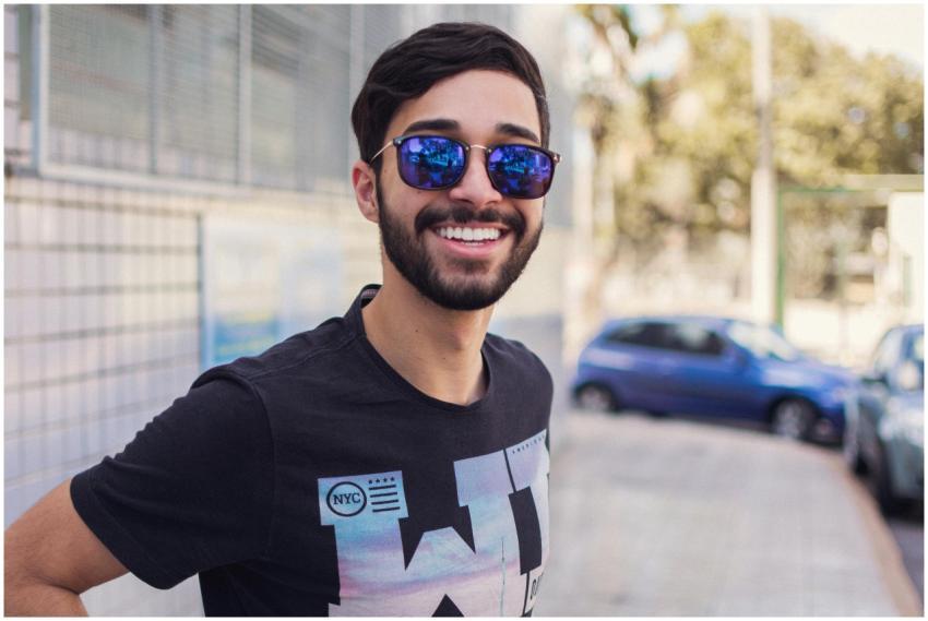 Portrait of a smiling man wearing sunglasses outdo