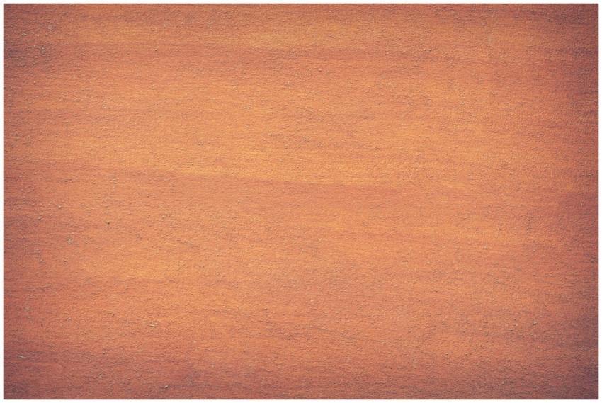 Vibrant orange textured surface, perfect for desig