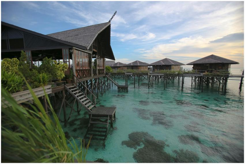 Scenic view of overwater bungalows on stilts in Ma