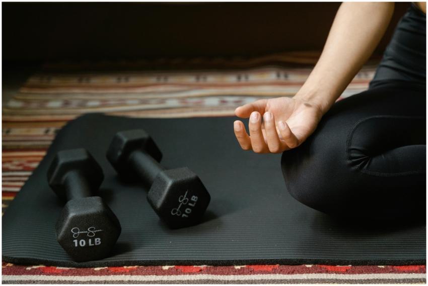 Close-up of a person's hand meditating next to dum