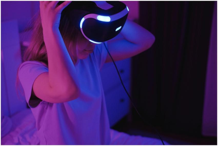 A young woman wearing VR glasses in a modern room,