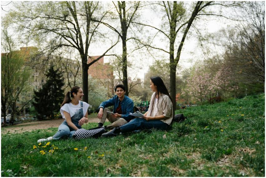 Group of college students sitting and chatting on