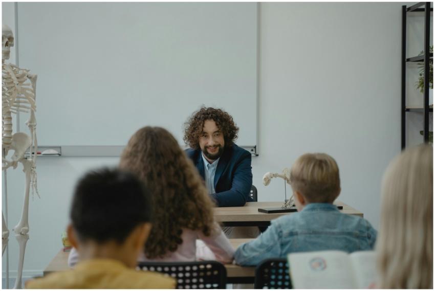 Teacher explains human anatomy using a skeleton mo