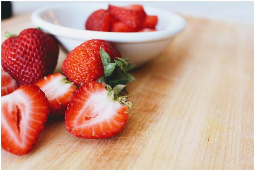 Close-up of fresh, juicy strawberries on a wooden