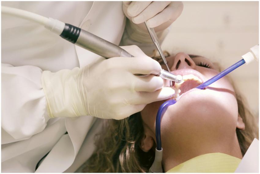 Close-up of a dental procedure with tools in a cli