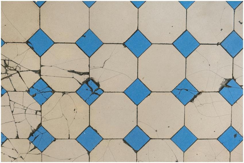 Top view of a cracked geometric tile pattern featu