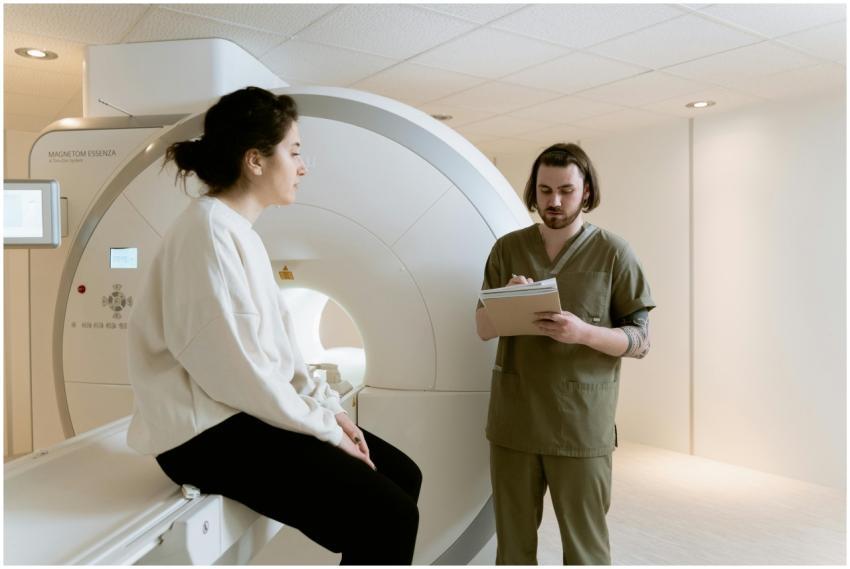 A patient undergoing an MRI scan with a healthcare