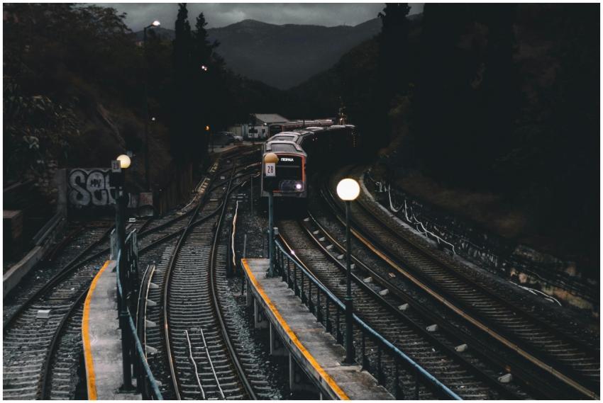 Dramatic nighttime scene of a train approaching a