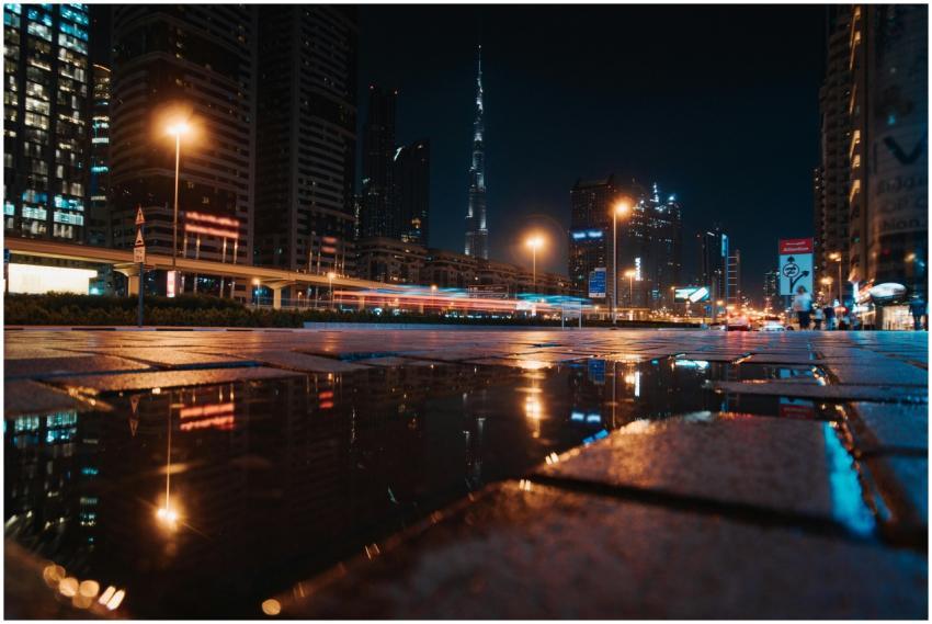A stunning nighttime cityscape of Dubai featuring