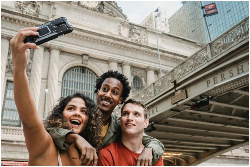 Group of friends capturing a joyful selfie in fron