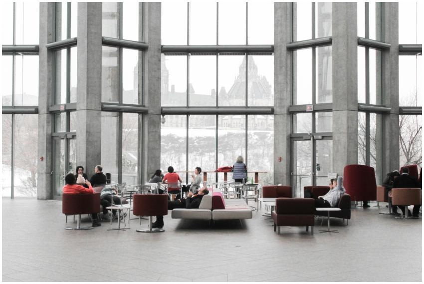 Spacious lounge with modern decor and large window