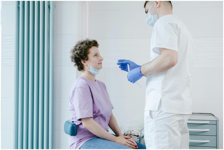 Healthcare worker performs a COVID-19 swab test on